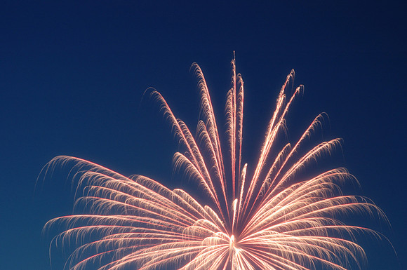 Partial fireworks, light blue sky